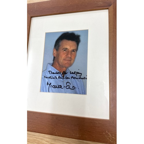 97 - Three framed signed photos, two authentic by Andrew Sachs and Michael Palin, and one possibly the si... 