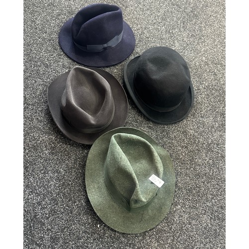 114 - Four top hats to include the names ' Earl land Brothers', 'Wood row Piccadilly London' etc