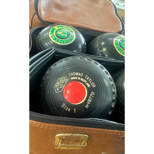 8 - Set of four vintage lawn bowls to include Thomas Taylor and bag