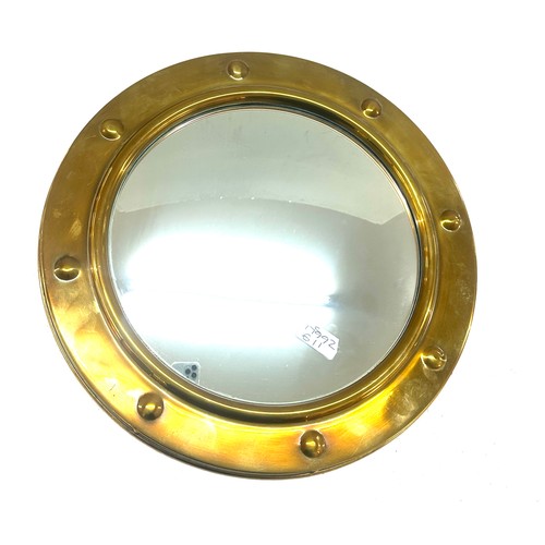 91 - Brass framed ship style mirror measures approx 16 inches wide