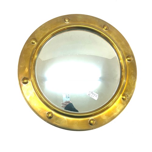 91 - Brass framed ship style mirror measures approx 16 inches wide