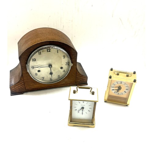 173 - Three clocks one mantel, two carriage largest measures 8.5 I inches tall by 12 inches wide and 5 dee... 