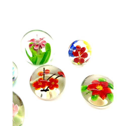 105 - Selection of assorted glass paper weights