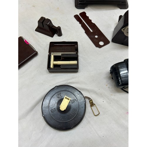 110 - Selection of Bakelite items includes camera, clock etc