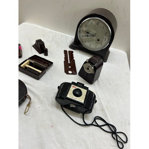 110 - Selection of Bakelite items includes camera, clock etc