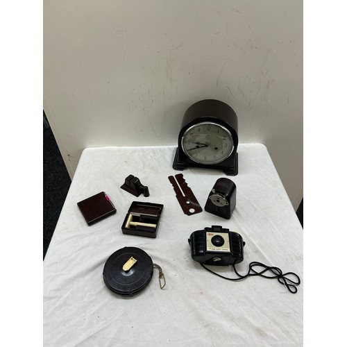 110 - Selection of Bakelite items includes camera, clock etc