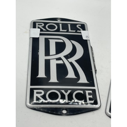 560 - 2 Rolls Royce plaques measures approximately 7 inches by 3.5 inches