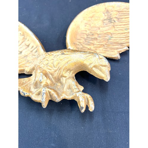 23 - Cast iron wall hanging eagle measures approx 24 inches wide by 9 inches tall