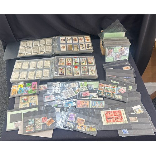 129 - Selection of vintage cigarette cards and stamps