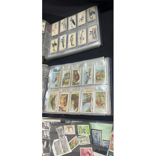 129 - Selection of vintage cigarette cards and stamps