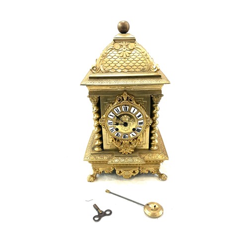 78 - Vintage brass 2 key hole mantel clock with key and pendulum, approximate measurements Height 14 inch... 