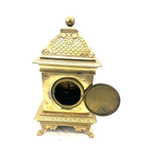 78 - Vintage brass 2 key hole mantel clock with key and pendulum, approximate measurements Height 14 inch... 