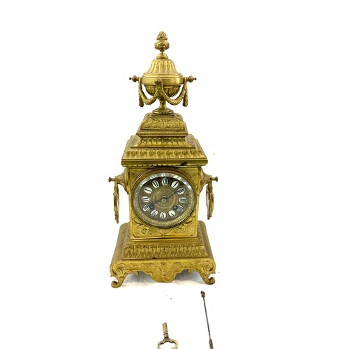 128 - Vintage brass 2 key hole mantel clock with key and pendulum, approximate measurements Height 16 inch... 