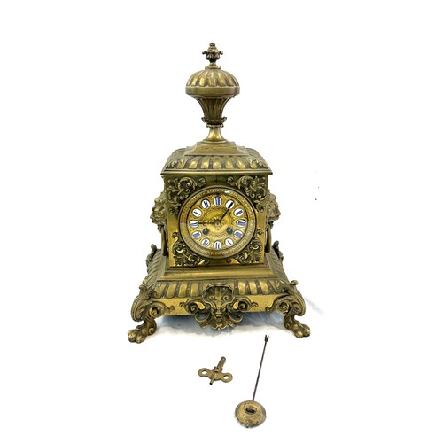 99 - Vintage brass 2 key hole mantel clock with key and pendulum, approximate measurements Height 17 inch... 