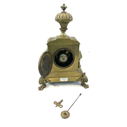 99 - Vintage brass 2 key hole mantel clock with key and pendulum, approximate measurements Height 17 inch... 