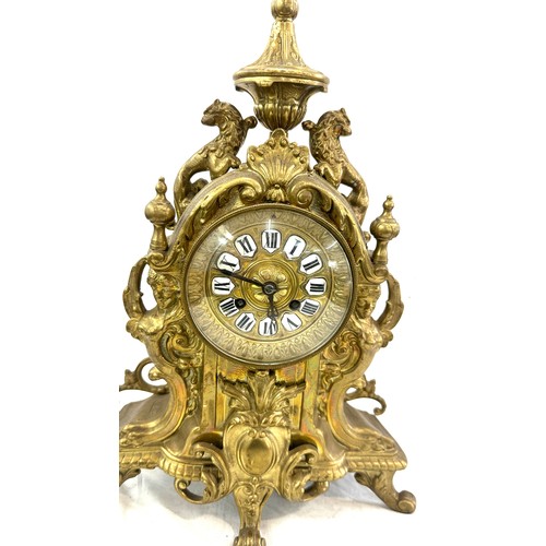 59 - Brass style mantel clock 17 inches tall 12 inches wide with key and pendulum