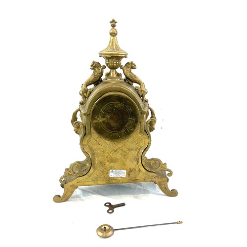 59 - Brass style mantel clock 17 inches tall 12 inches wide with key and pendulum