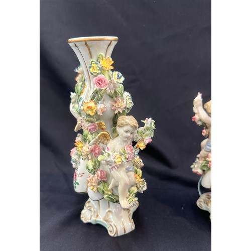 27 - Pair Meissen style cherub candle sticks, height 9 inches, width 6 inches