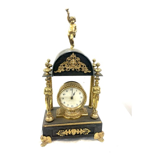 86 - Vintage brass and metal clock with key measures approx 18 inches tall by 9 inches wide