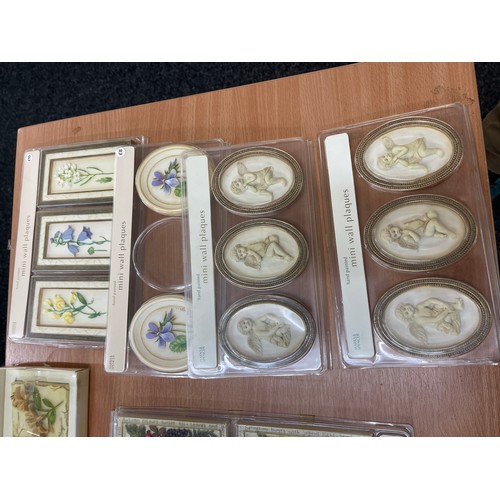 202 - Selection of Marks and Spencer's mini wall plaques, new in boxes