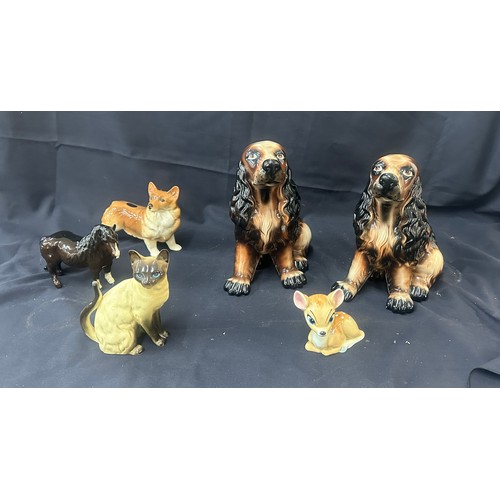 104 - Selection of porcelain animal figures, dogs, cats, wade Disney Bambi  etc