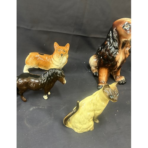 104 - Selection of porcelain animal figures, dogs, cats, wade Disney Bambi  etc