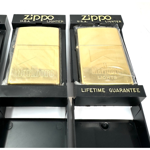 552 - 4 as new Zippo lighters all original boxed