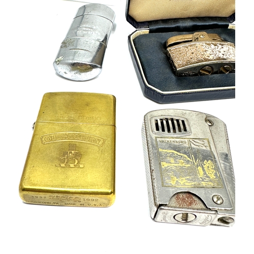 554 - Collection of vintage cigarette lighters includes zippo etc