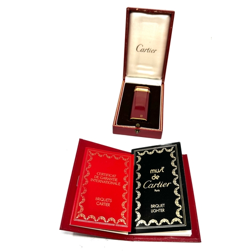 556 - Boxed Cartier cigarette lighter original box & booklets