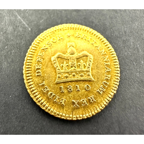 522 - A rare, collectable gold Third-Guinea of King George III, dated 1810. The obverse features the fifth... 