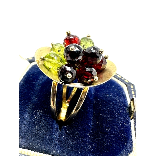 115 - 14ct gold peridot & garnet ring weight 6.5g