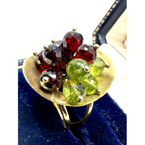 115 - 14ct gold peridot & garnet ring weight 6.5g