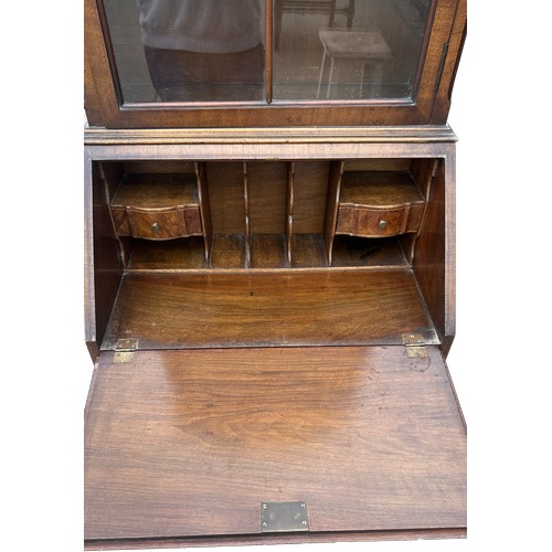 437 - Antique walnut bureau bookcase measures approx 71 inches tall, 25 wide and 18 deep