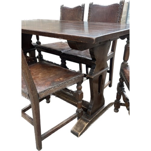 412 - Oak antique refectory table and 6 leather and oak chairs table measures approx 30 inches tall, 54 wi... 