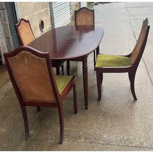 424 - Mahogany table and four chairs with bergere chairs