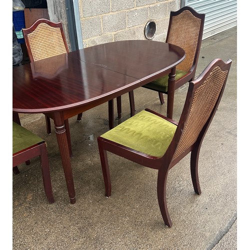 424 - Mahogany table and four chairs with bergere chairs