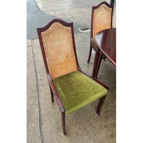 424 - Mahogany table and four chairs with bergere chairs