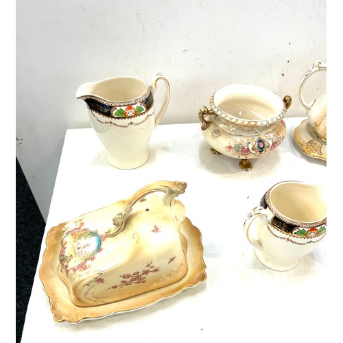 345 - Selection of assorted pottery includes cheese dish, candle stick etc