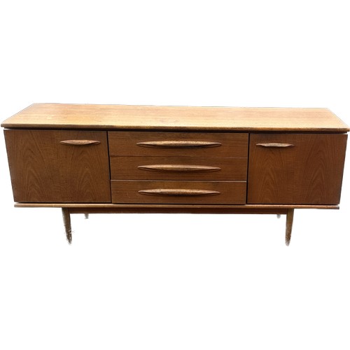 407 - Teak two door three drawer sideboard measures approx 30.5 inches high, 72 long and 19 deep