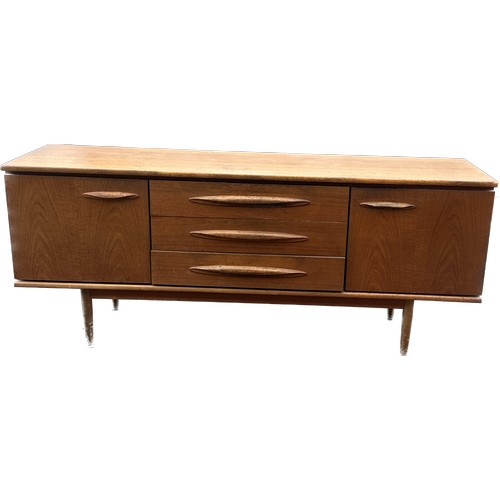 407 - Teak two door three drawer sideboard measures approx 30.5 inches high, 72 long and 19 deep