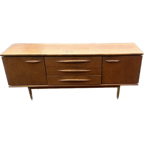 407 - Teak two door three drawer sideboard measures approx 30.5 inches high, 72 long and 19 deep