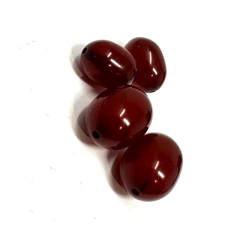 334 - 2 pairs of matching size cherry bakelite beads both pairs have internal streaking would make great e... 