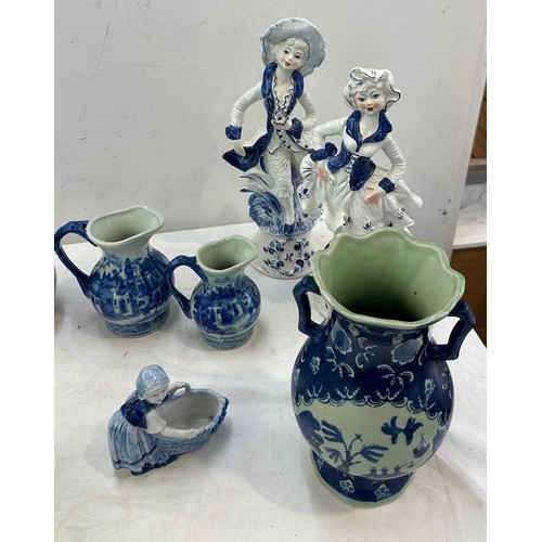 381 - Selection of blue and white pottery includes figures, jugs etc