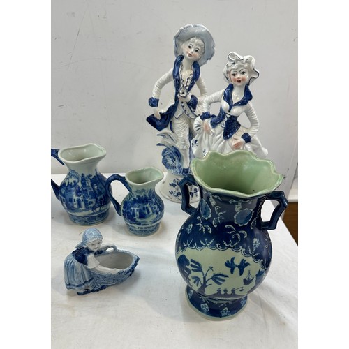 381 - Selection of blue and white pottery includes figures, jugs etc