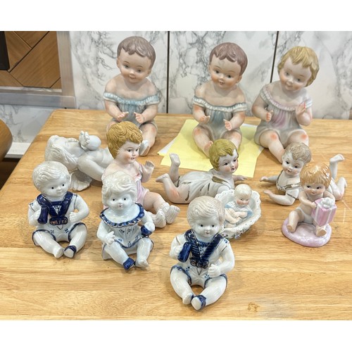 376 - Large selection of assorted Baby figures includes Piano babies etc