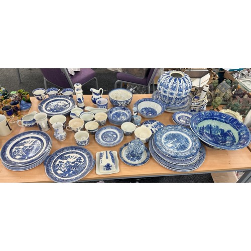 386 - Large selection of blue and white pottery to include plates, vases etc