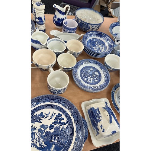 386 - Large selection of blue and white pottery to include plates, vases etc