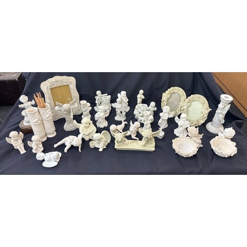 395 - Large selection of Cherub figures includes candle sticks, photo framed etc