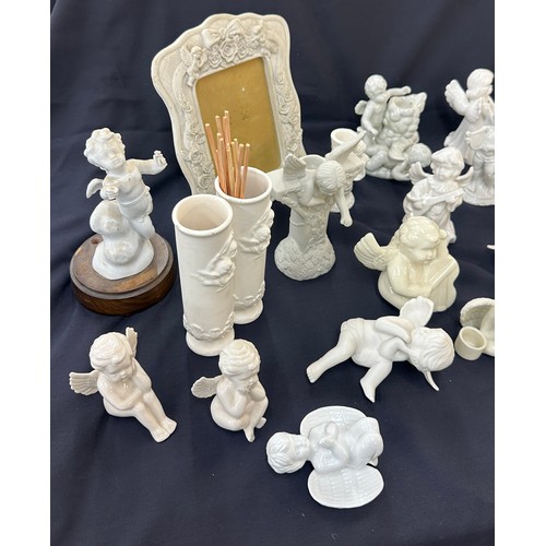 395 - Large selection of Cherub figures includes candle sticks, photo framed etc