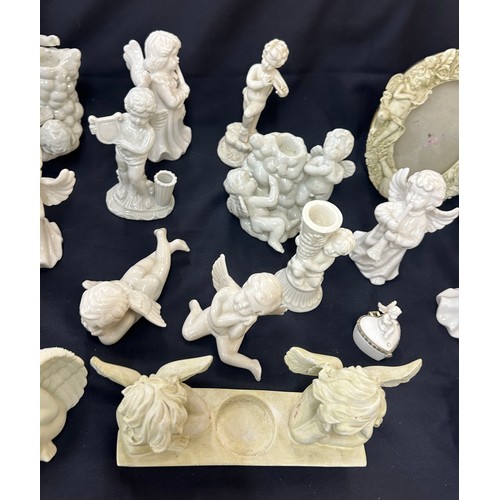 395 - Large selection of Cherub figures includes candle sticks, photo framed etc